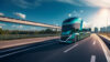 A sleek futuristic semi-truck driving on a highway, with a clear blue sky above and the sun setting in the distance, signifying advanced, clean energy transportation technology.