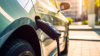 Industries - Passenger Vehicles - Electric - Electric is the new normal. A charging car in a modern sorrouding