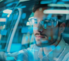 A consultant with smart glasses are working in a car on the windshielt