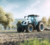 Modern agricultural tractor operating in a cultivated field, representing sustainable farming, agricultural technology, and efficient land use in rural environments